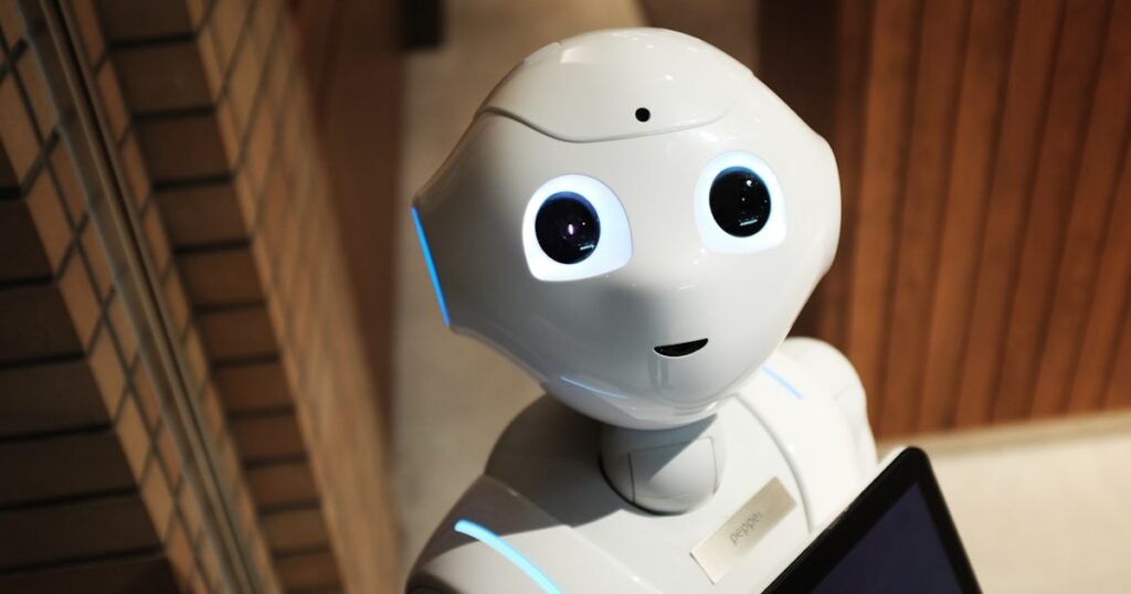 Humanoid robot symbolizing the 2026 wave of AI layoffs and the wealth transfer from labor to capital