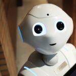 Humanoid robot symbolizing the 2026 wave of AI layoffs and the wealth transfer from labor to capital