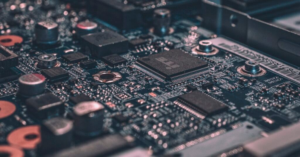 Close-up of computer memory chips on a circuit board, illustrating the 2026 AI memory supercycle driving DRAM prices and Micron revenue higher