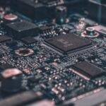 Close-up of computer memory chips on a circuit board, illustrating the 2026 AI memory supercycle driving DRAM prices and Micron revenue higher