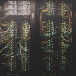 Rows of servers inside an AI data centre, representing the debt-financed AI infrastructure buildout
